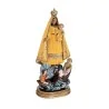 Virgen Caridad del Cobre - Manto Amarillo 30 cm | La Virgen Caridad del Cobre con manto en amarillo es una figura de resina de 30 cm de altura que representa a la Patrona de Cuba. Se celebra el 8 de septiembre y es importante para los católicos y otros devotos de la Virgen. La figura está asociada con la diosa Ochún en la religión sincrética de la santería, y es a menudo representada con elementos como el color amarillo y símbolos de la naturaleza. La figura de la Virgen está hecha de resina, un material resistente y duradero, y es detallada y bien acabada, presentando a la Virgen vestida con un manto amarillo que simboliza la luz y la esperanza. Esta figura es un regalo popular y un objeto de devoción para muchos creyentes, quienes creen que la presencia de la Virgen Caridad del Cobre en sus vidas puede traer bendiciones y protección divina. | Tienda Esotérica Changó